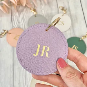 Personalized Saffiano PU leather round keychain with custom gold foil letter monogram keyring.