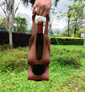 Outdoor portable PU leather wine bottle holder detail scene, durable strap design for camping.