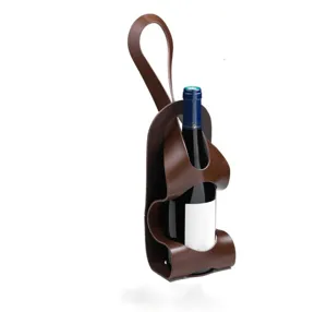 Detail shot of the brown PU leather wine carrier sleeve, featuring a hanging strap and secure bottle fit.