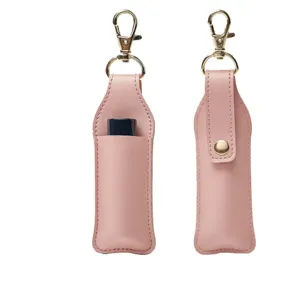 Pink PU leather lipstick holder keychain pouch detail, portable mini cosmetic bag charm.