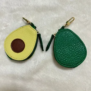 Cute avocado PU leather coin purse with metal clasp and zipper, perfect for holding items.