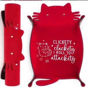 Detailed view of the red leather cat dice tray, showing snap buttons and printed fun game text.