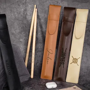 Laser engraved PU leather drumstick bag with custom name, durable percussion instrument storage.