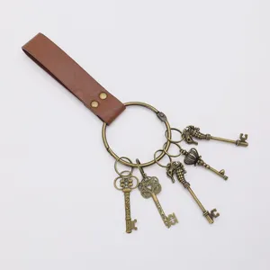 Medieval PU leather vintage keyring with multiple decorative brass skeleton keys for cosplay.