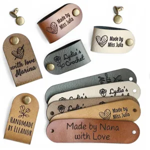 Custom leather labels with rivets for handmade crochet knitting DIY crafts and personalized sewing.