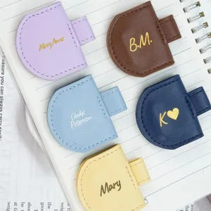 Custom PU leather magnetic bookmark pen holder, dual-use stationery office accessory.