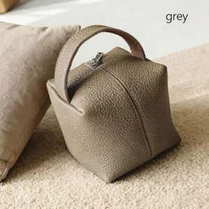 Bolsa de maquillaje de cuero gris con asa, lindo estuche portátil de almacenamiento.