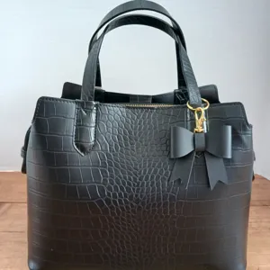 Black crocodile pattern faux leather handbag with cute bow charm and double handles
