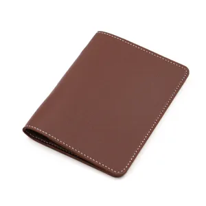 Brown PU leather passport holder, travel portable wallet for cards, visa, and tickets.