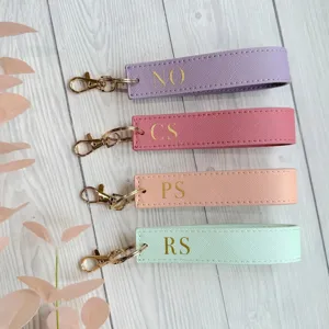 PU leather wristlet keychain with gold hardware and custom letters, stylish car key holder strap.