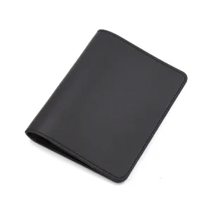 Close up of black pu leather passport holder detail, compact travel document wallet pocket.