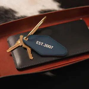 Blue PU leather rhombus keychain with brass key ring and metal keys for daily use.