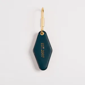 Dark teal PU leather diamond keychain with gold hardware detail, elegant and practical accessory.