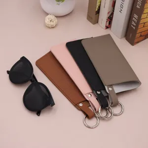 Portable PU leather glasses pouch with spring ring, dustproof sunglasses storage.