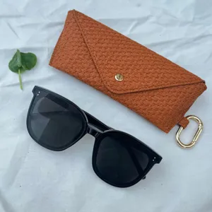 Portable sunglasses case with woven texture and stylish black sun glasses set for travel daily use.