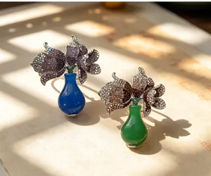 Detailed close-up of exquisite tulip vase brooch, sparkling rhinestones, elegant fashion accessory.