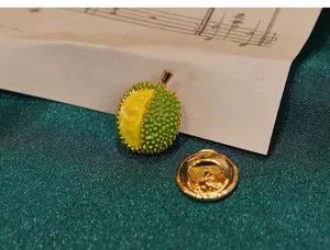 Detailed shot of a cute glazed durian brooch lapel pin with gold backing and enamel fruit design.