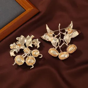 Broche colgante de planta de caqui dorada vintage vista trasera para abrigo de mujer elegante