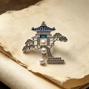 Detail view of the Chinese style pavilion pearl brooch, exquisite metal and crystal craftsmanship.