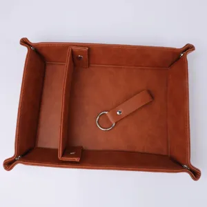 Brown PU leather desk valet tray detail featuring snap buttons, divider and metal ring loop.