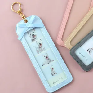 Detailed view of the light blue PU leather photo keychain with cute bow and 4-grid photos.