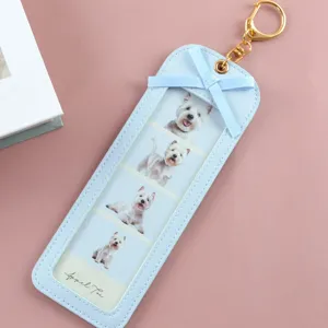 Cute blue PU leather photo keychain with four slots and bow for DIY couple picture holders.