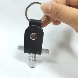 Drum tuning key with PU leather protective case and keyring, portable percussion tool.
