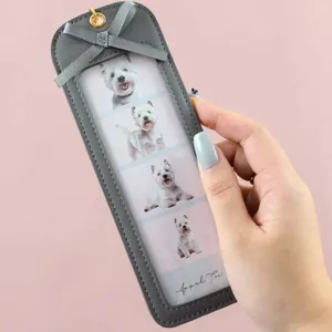 Detail view of Korean PU leather pet photo keychain, cute 4-grid photo holder pendant.