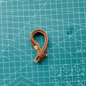 Brown PU leather connection buckle strap with metal snap button for bag accessory DIY crafting.