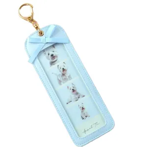 Light blue PU leather photo holder keychain with cute bow and four grid slots for pictures.