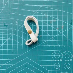 White PU leather bag strap connector buckle detail view, premium hardware snap button accessory.