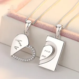 Silver couple interlocking heart puzzle pendant necklace set with sparkling crystal stones.