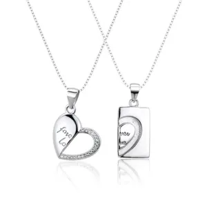Silver couple necklace set featuring interlocking heart and rectangular pendants with crystal accents.