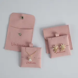 Pink velvet jewelry pouch set with snap button and cards for rings necklaces storage.