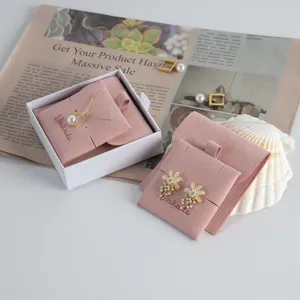 Pink velvet jewelry pouch set with snap button, elegant storage bag for rings and earrings.