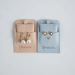 Velvet jewelry pouch set with snap button flap, perfect for storing rings and earrings safely.