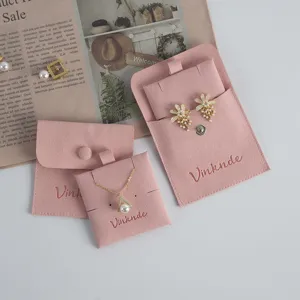 Pink velvet jewelry storage bag detail, soft snap button pouches for earrings, rings and necklaces.