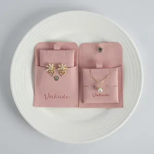 Pink velvet jewelry pouch set with snap button for ring, earrings and necklace storage.