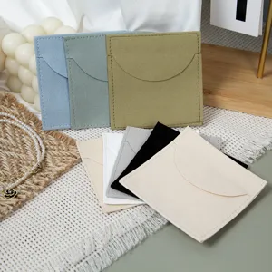 Detailed view of multi-color suede jewelry pouches, perfect for storing rings and small gifts.