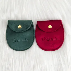Pochette a bijoux en velours avec bouton pression, sac cadeau portable pour accessoires.