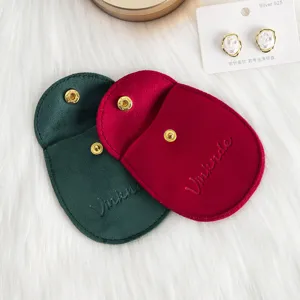 Pochette en velours avec bouton pression pour bijoux, petit sac cadeau élégant et pratique.