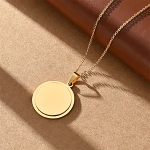 Stainless steel smooth minimalist round pendant necklace detail view, elegant daily wear jewelry.