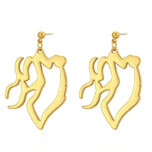 Gold irregular abstract silhouette stud earrings detail view, modern fashion jewelry.