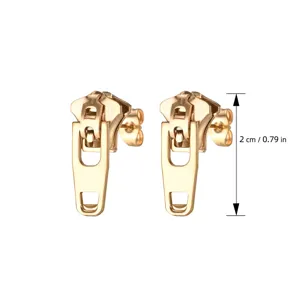 Detail view of minimalist gold zipper stud earrings, showing 2cm length and metal finish.