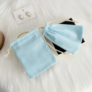 Hellblaue Leinen-Kordeltasche zur Schmuckaufbewahrung, Geschenkverpackung und für kleine Accessoires.