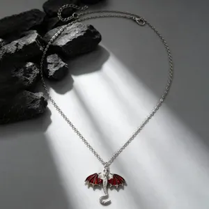 Detailed view of alloy flying dragon pendant necklace with red wings for fashion lovers.