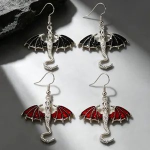 Detailed view of gothic dragon earrings featuring alloy black and red winged monster pendants.