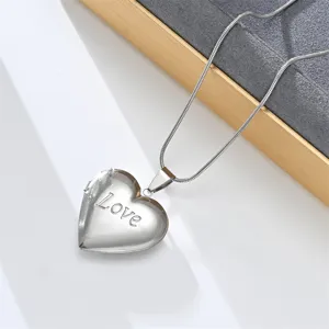 Stainless steel heart locket pendant necklace for women, elegant vintage style silver chain.