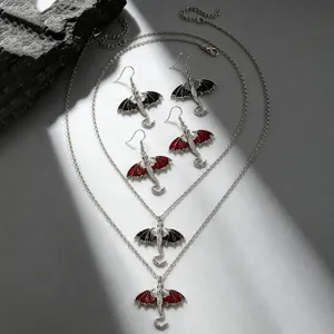 Silver alloy dragon necklace earrings set with black and red wings for gothic fashion style.