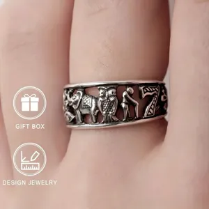 Retro carved silver ring detail showing intricate elephant and owl animal cutouts for unique style.